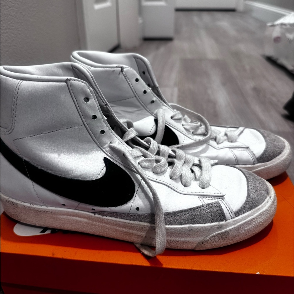 Nike women’s White and Black High-Top Sneakers